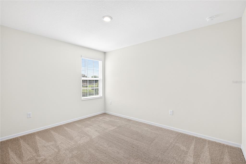 13430 Leaping Water Way Astatula, FL 34705 - Photo 42 of 55 a view of an empty room with a window