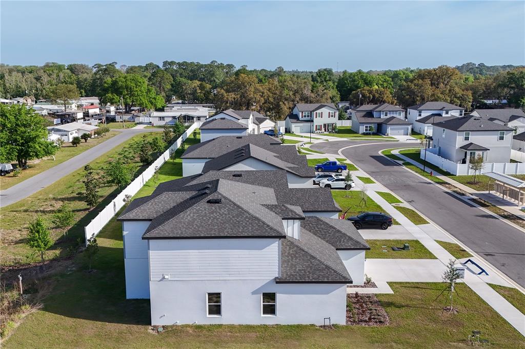 13430 Leaping Water Way Astatula, FL 34705 - Photo 48 of 55 a aerial view of a house with a yard pool an outdoor seating