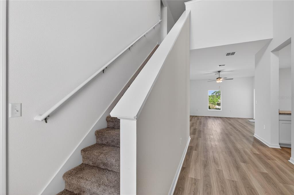 13430 Leaping Water Way Astatula, FL 34705 - Photo 5 of 55 a view of entryway and hall with wooden floor
