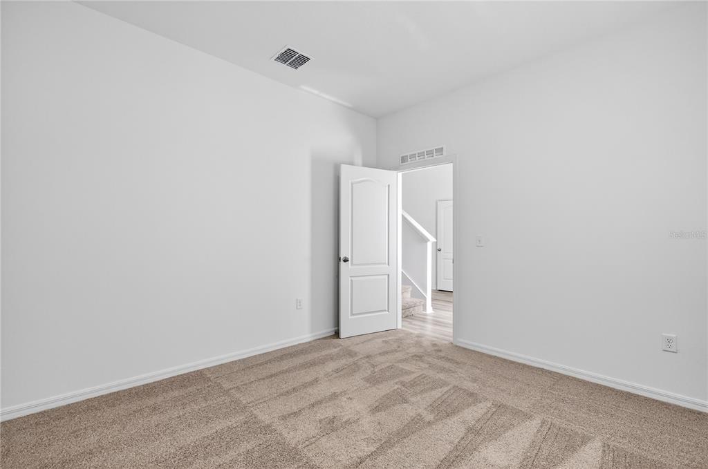 13430 Leaping Water Way Astatula, FL 34705 - Photo 6 of 55 a view of an empty room