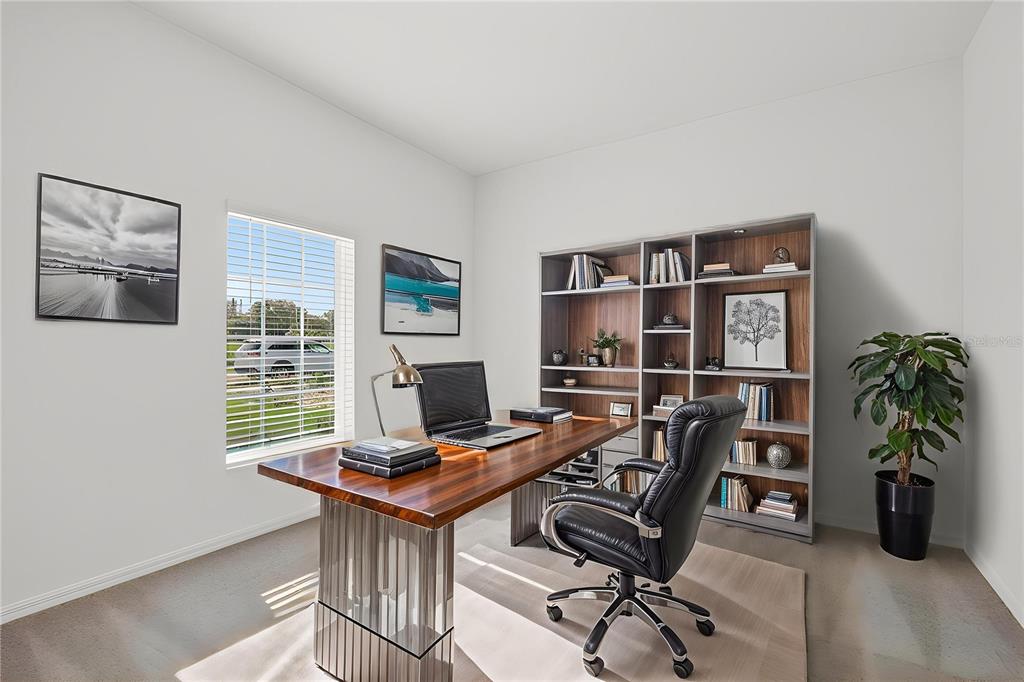 13430 Leaping Water Way Astatula, FL 34705 - Photo 7 of 55 a view of a workspace with furniture and a window