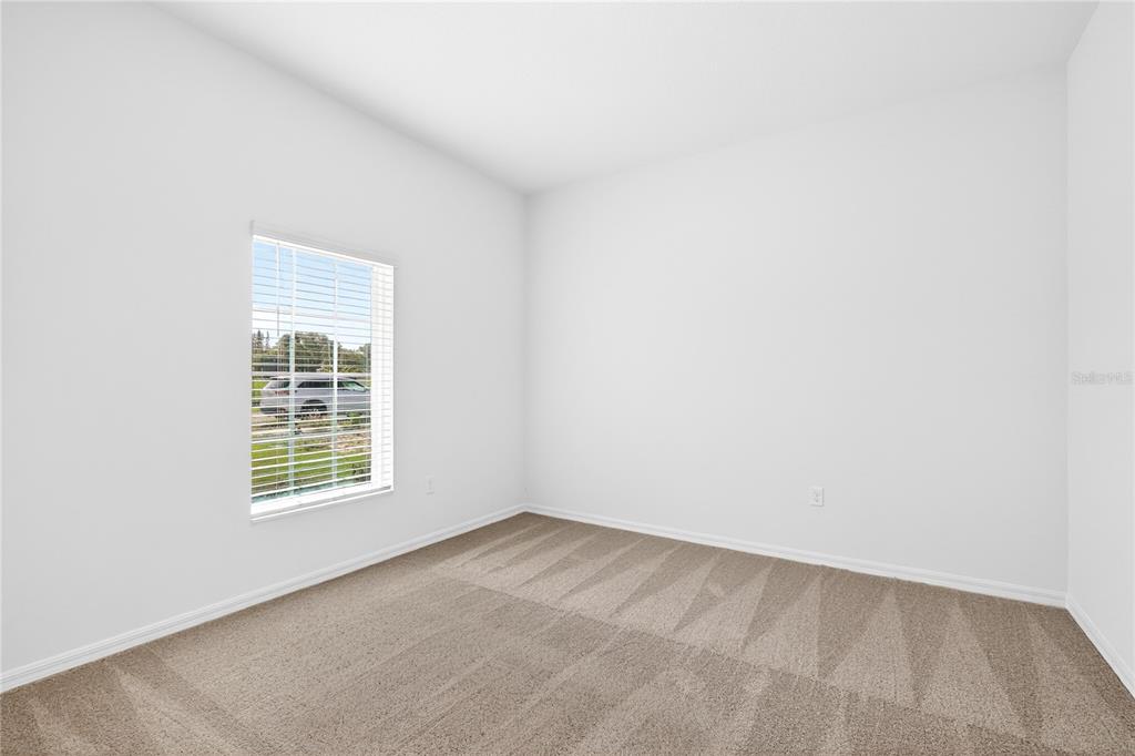 13430 Leaping Water Way Astatula, FL 34705 - Photo 8 of 55 an empty room with a window