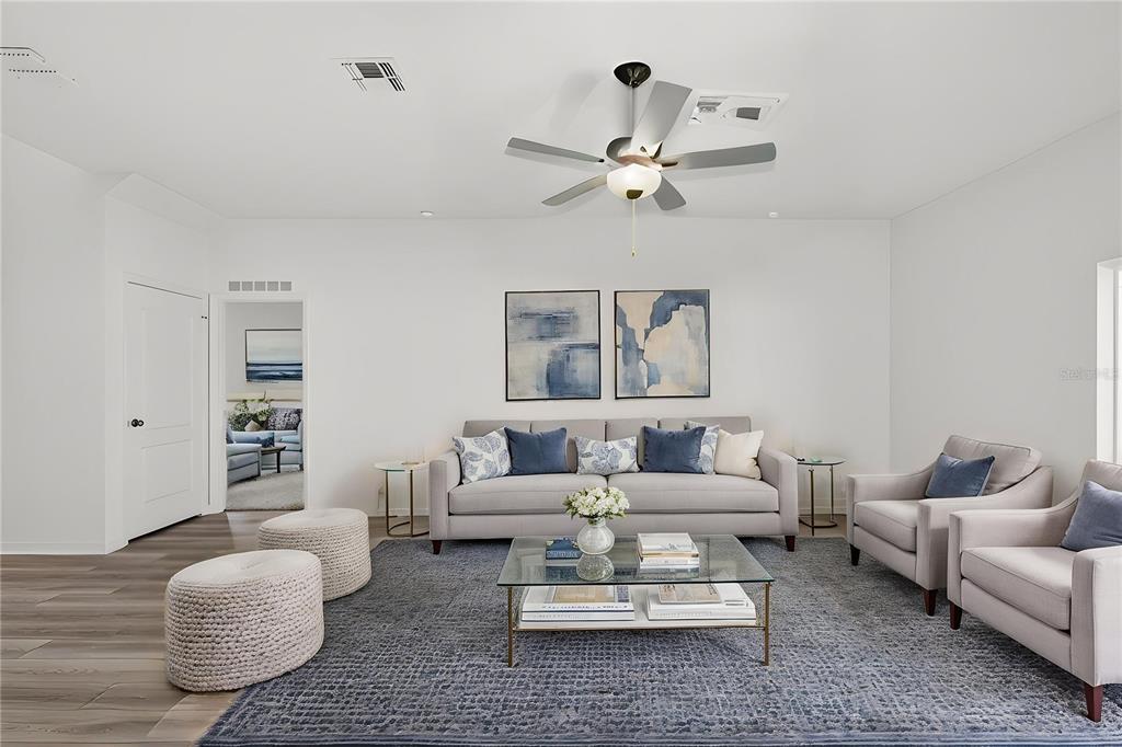 13430 Leaping Water Way Astatula, FL 34705 - Photo 10 of 55 a living room with furniture and a large window