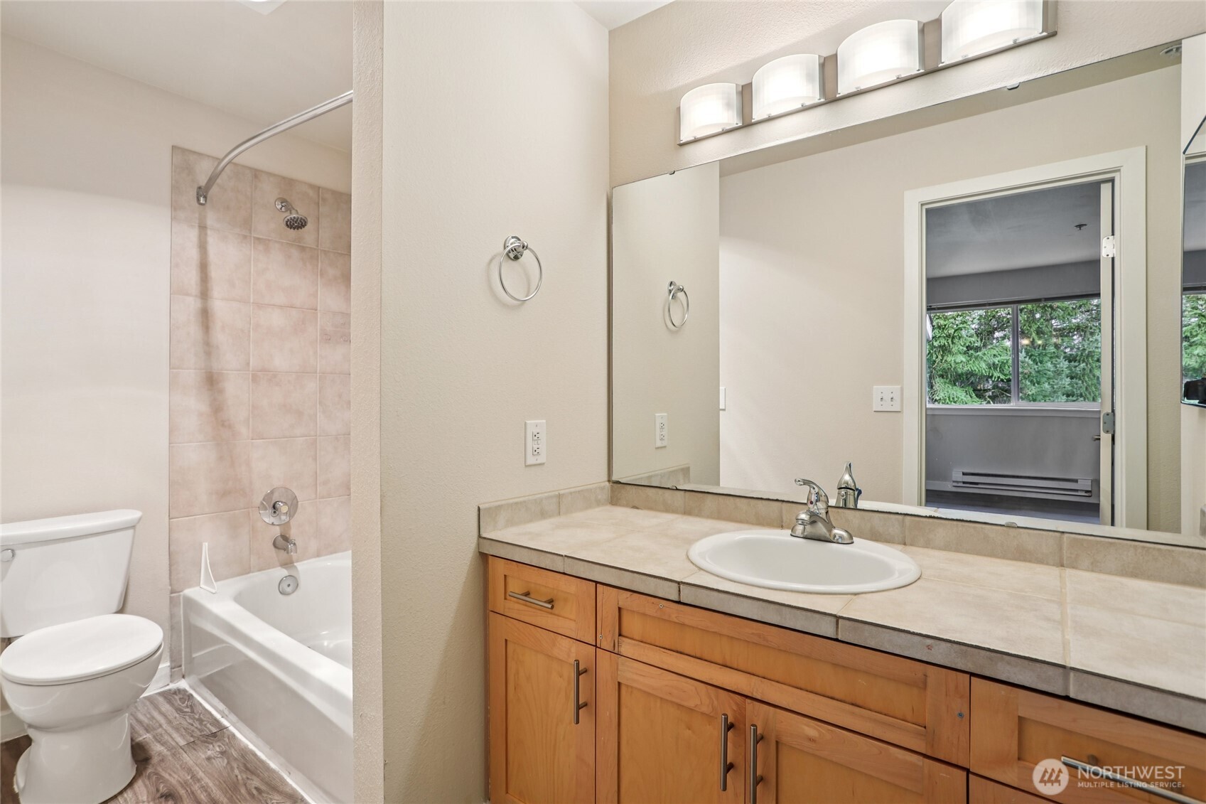 3927 243rd Place Southeast, Unit I304 Bothell, WA 98021 - Photo 15 of 28 a bathroom with a sink a toilet and shower