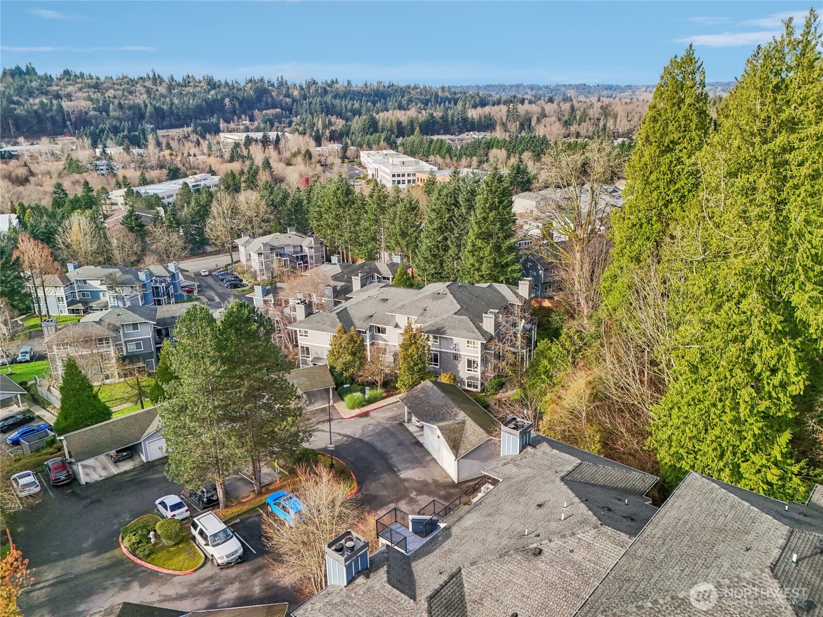 3927 243rd Place Southeast, Unit I304 Bothell, WA 98021 - Photo 22 of 28 an aerial view of a house with yard swimming pool and lake view
