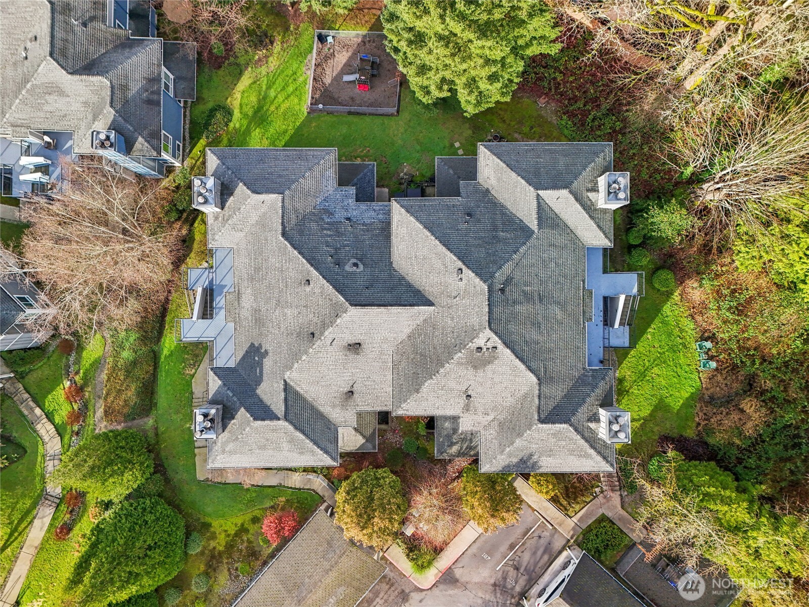 3927 243rd Place Southeast, Unit I304 Bothell, WA 98021 - Photo 24 of 28 an aerial view of a house with garden space and street view