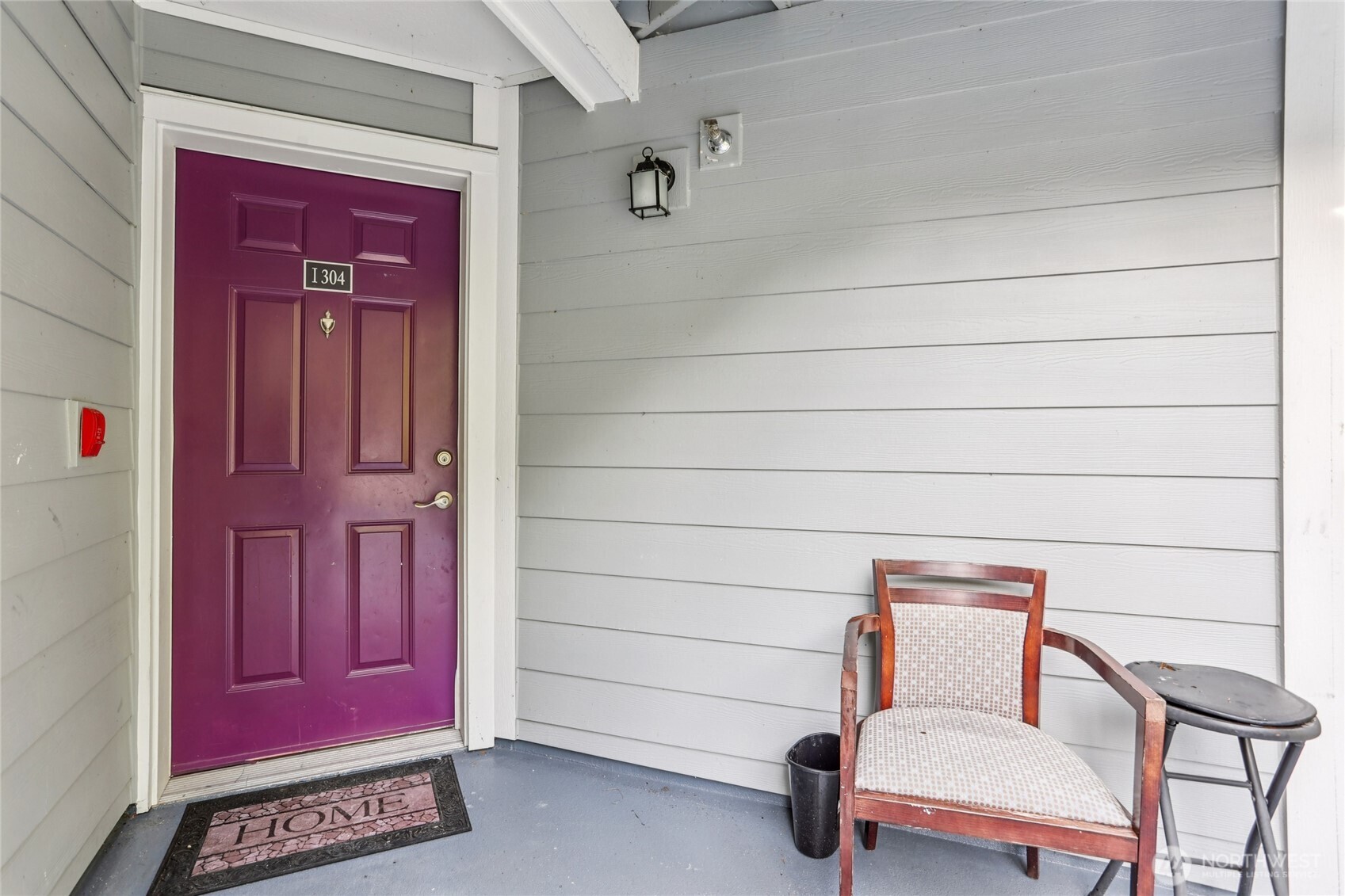 3927 243rd Place Southeast, Unit I304 Bothell, WA 98021 - Photo 4 of 28 a chair and a table in a room