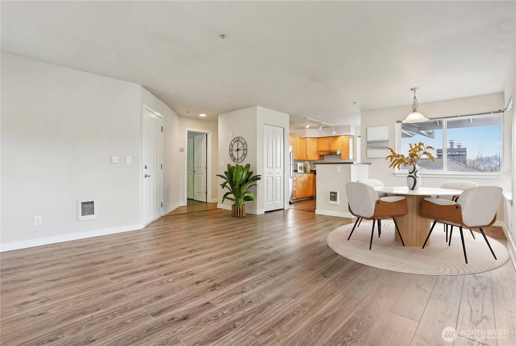 3927 243rd Place Southeast, Unit I304 Bothell, WA 98021 - Photo 7 of 28 a view of a dining room with furniture and wooden floor