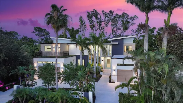 a living room with furniture kitchen view and a large window