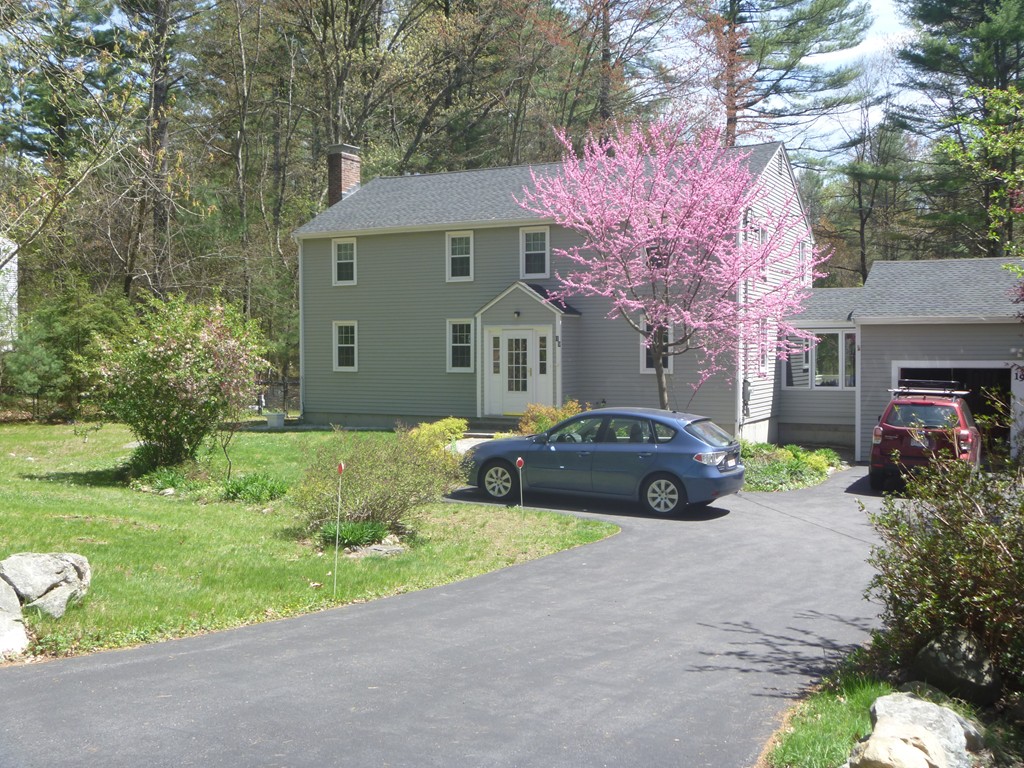 19 No Name Road Stow, MA 01775 - Photo 1 of 21 a front view of a house with garden