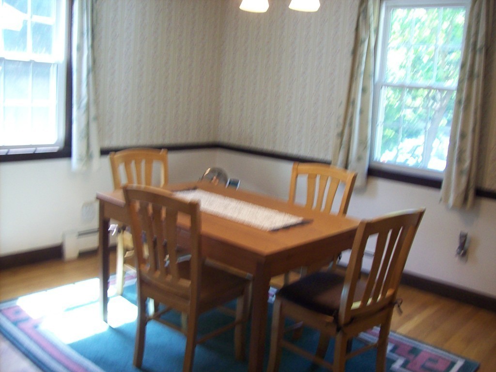 19 No Name Road Stow, MA 01775 - Photo 6 of 21 a view of a dining room with furniture window and wooden floor