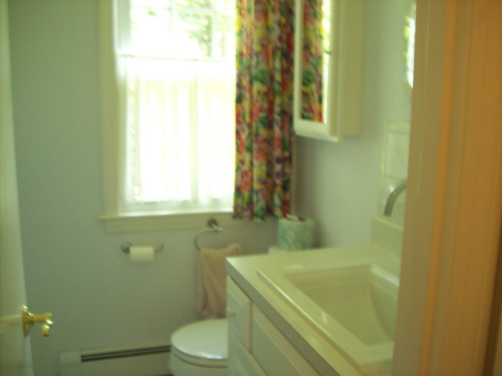 19 No Name Road Stow, MA 01775 - Photo 10 of 21 a bathroom with a sink and a toilet
