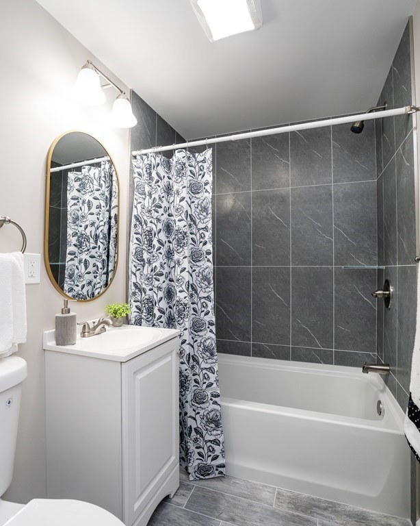 152 Shady Brook Lane Springfield, MA 01118 - Photo 11 of 26 a bathroom with a sink toilet and shower