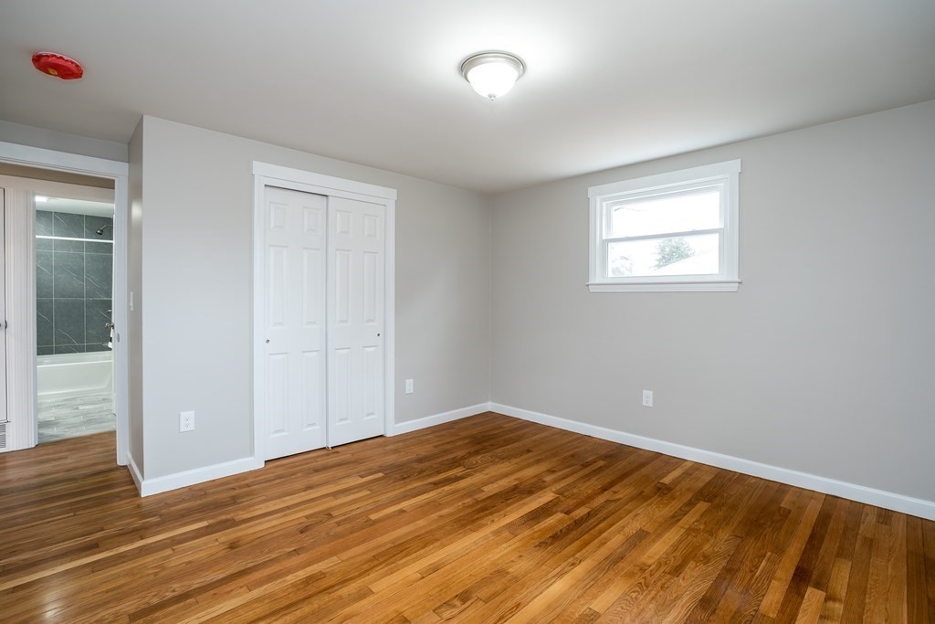 152 Shady Brook Lane Springfield, MA 01118 - Photo 13 of 26 a view of empty room with wooden floor