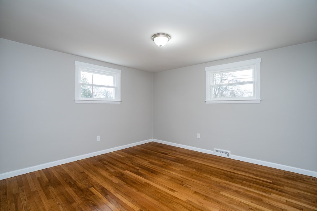 152 Shady Brook Lane Springfield, MA 01118 - Photo 15 of 26 a view of empty room with wooden floor