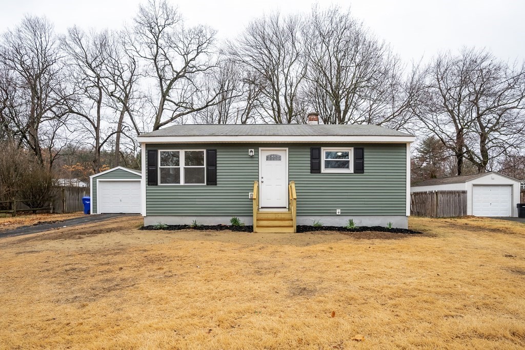 152 Shady Brook Lane Springfield, MA 01118 - Photo 21 of 26 a view of a house with a yard covered in snow