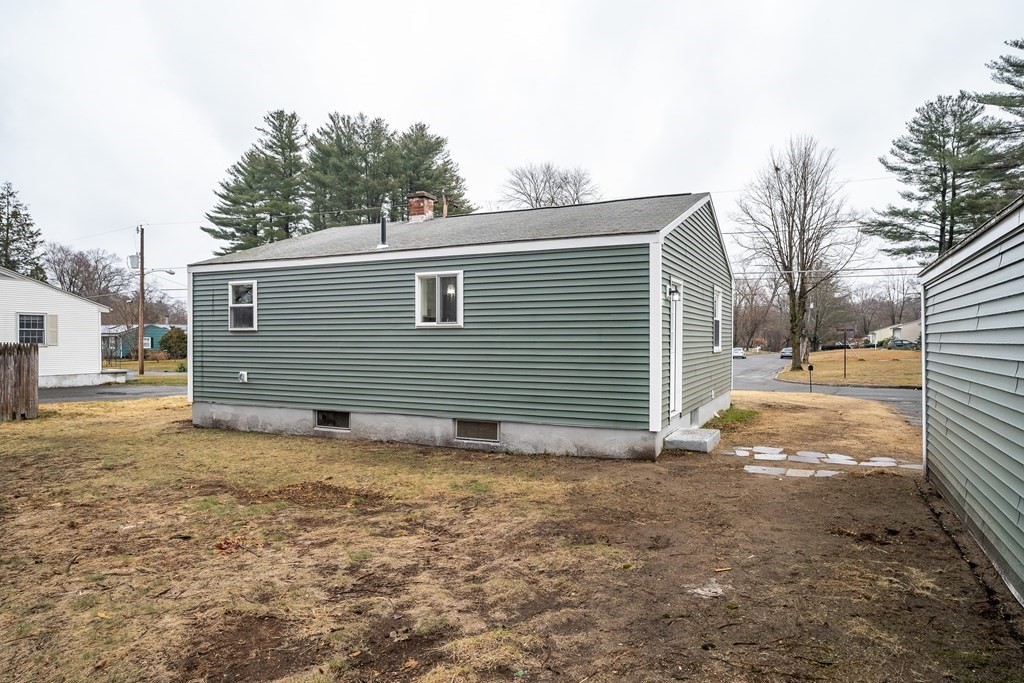 152 Shady Brook Lane Springfield, MA 01118 - Photo 24 of 26 a view of a house with a yard