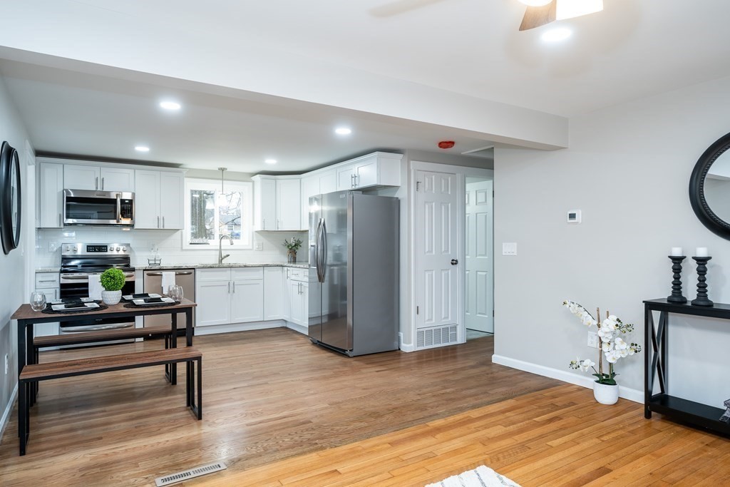 152 Shady Brook Lane Springfield, MA 01118 - Photo 6 of 26 a kitchen with stainless steel appliances a refrigerator and a stove top oven