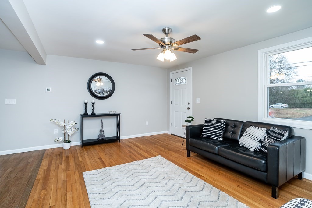 152 Shady Brook Lane Springfield, MA 01118 - Photo 8 of 26 a living room with a bed furniture and a window