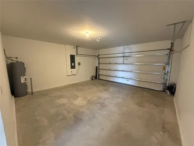 a view of a house with backyard and space