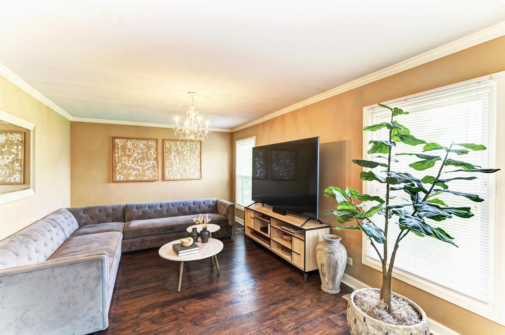 2210 Ridge Avenue Aurora, IL 60504 - Photo 12 of 29 a living room with furniture and a flat screen tv