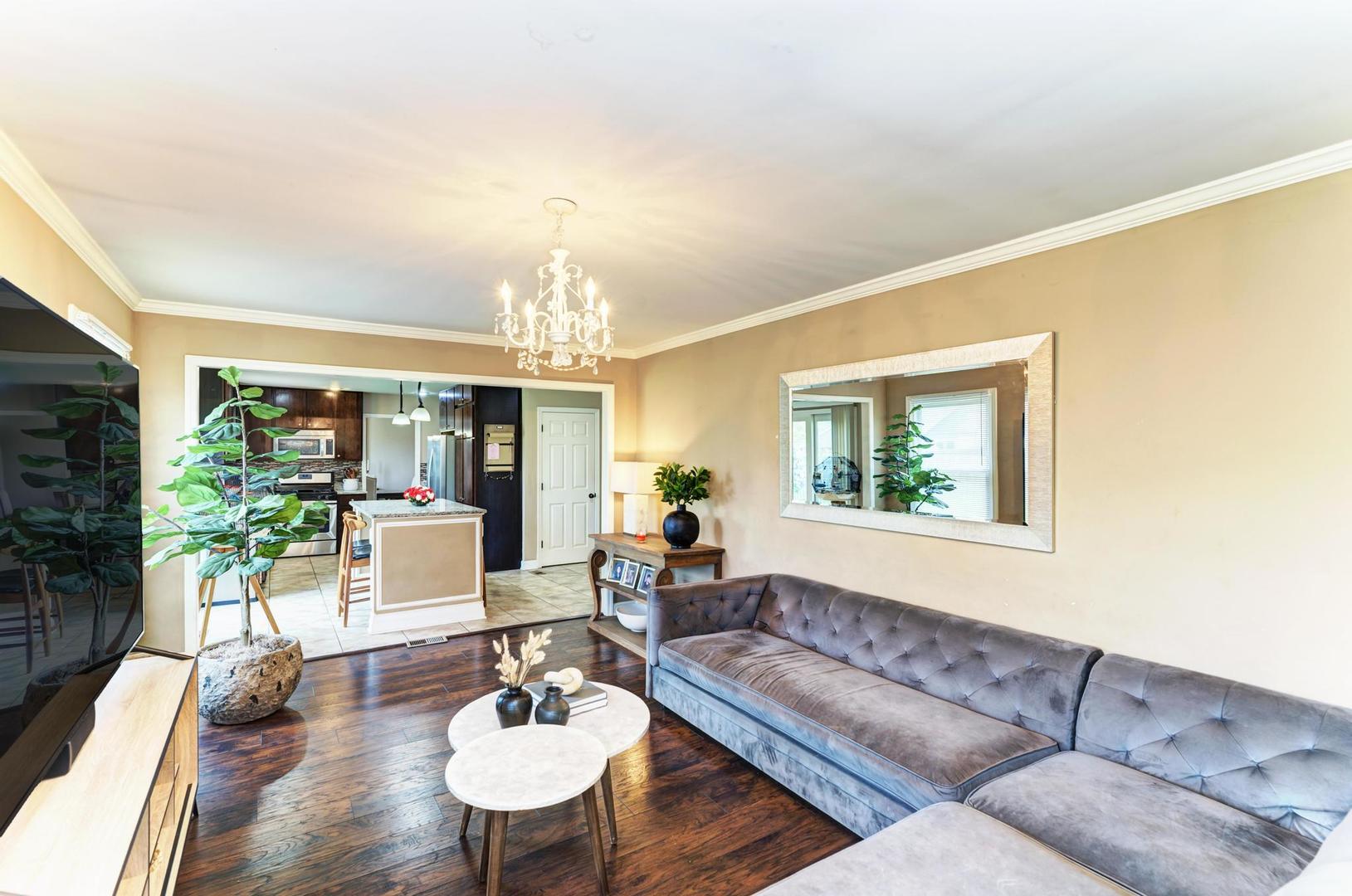 2210 Ridge Avenue Aurora, IL 60504 - Photo 13 of 29 a living room with furniture and a chandelier