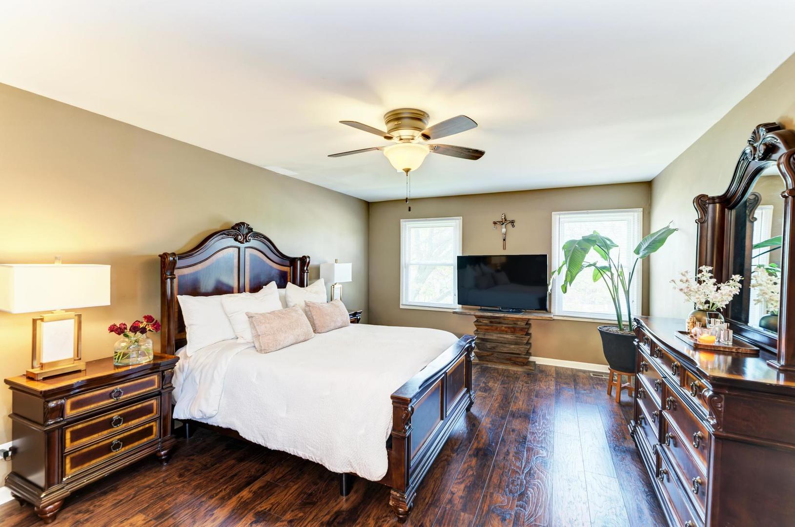 2210 Ridge Avenue Aurora, IL 60504 - Photo 17 of 29 a bedroom with a bed and a flat screen tv