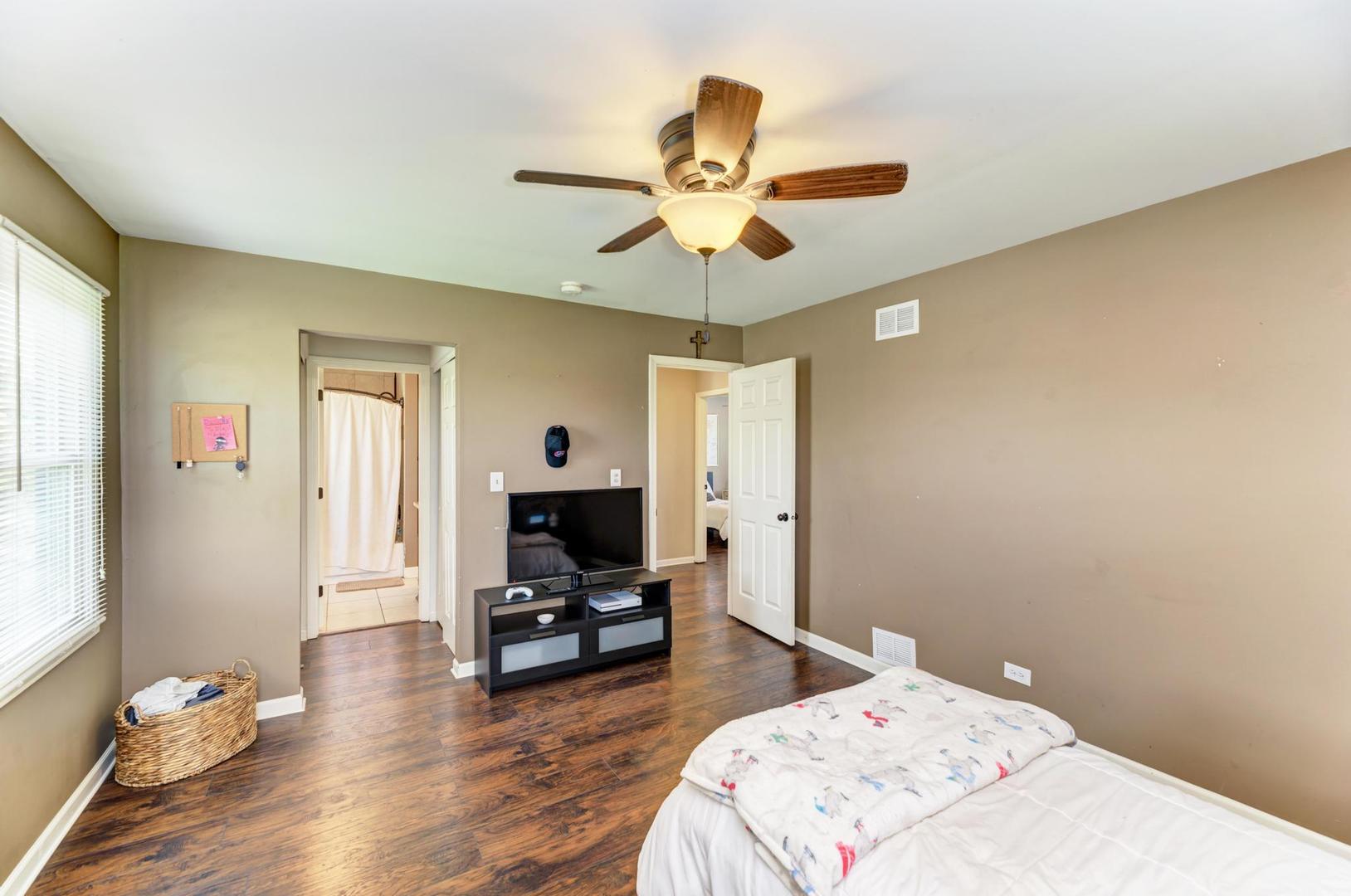 2210 Ridge Avenue Aurora, IL 60504 - Photo 27 of 29 a living room with furniture and wooden floor
