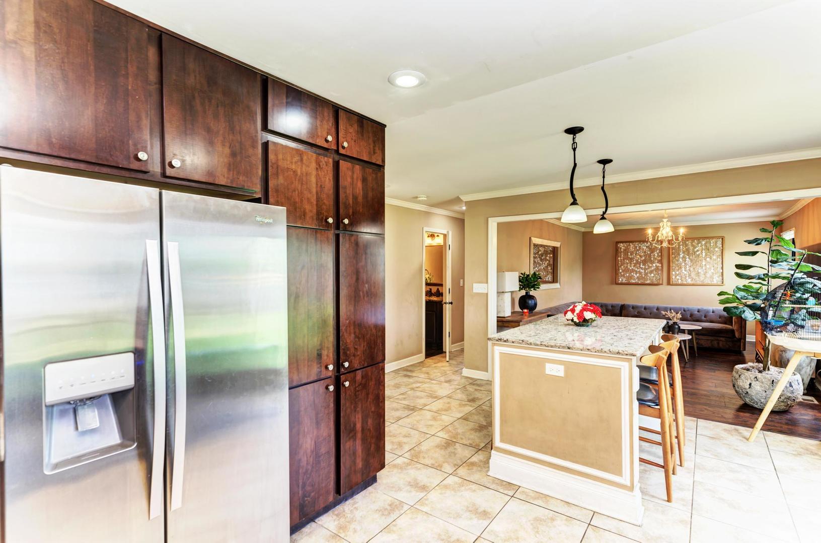 2210 Ridge Avenue Aurora, IL 60504 - Photo 10 of 29 a very nice looking kitchen with a large window cabinets and stainless steel appliances