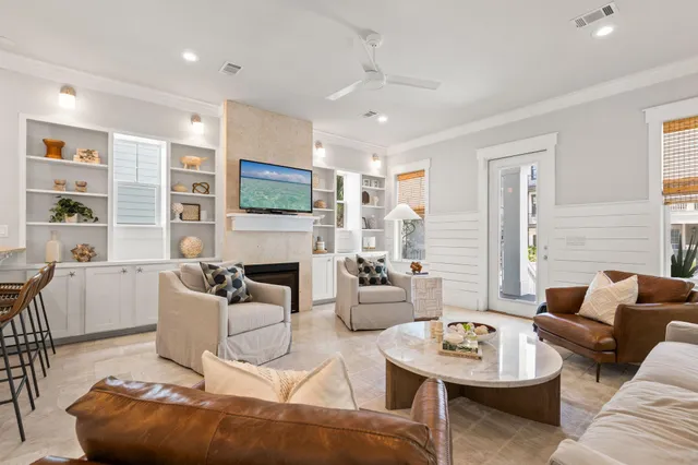 a living room with furniture kitchen and a table