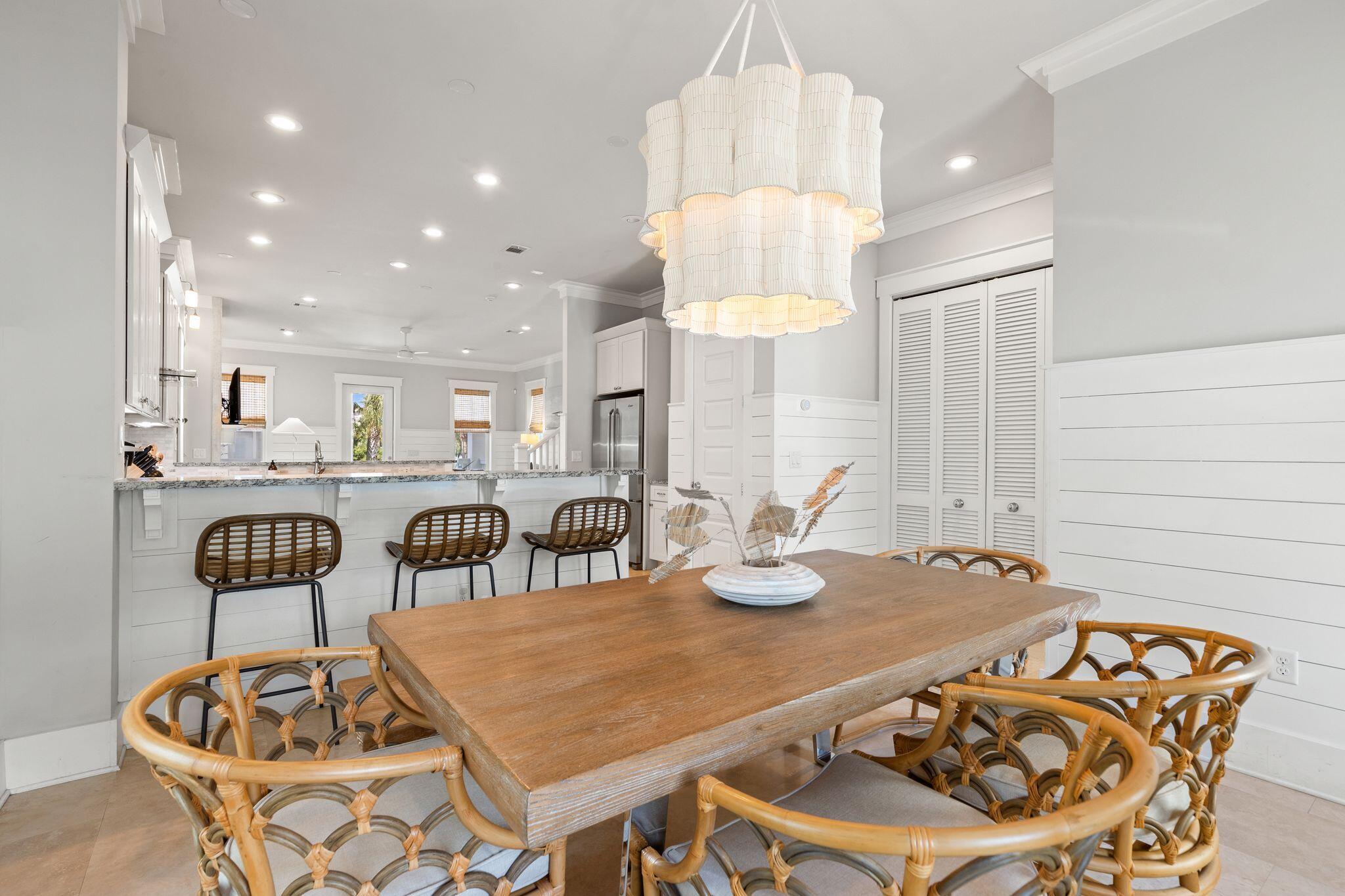 51 Trigger Trail East Inlet Beach, FL 32461 - Photo 19 of 57 a kitchen with a dining table and chairs