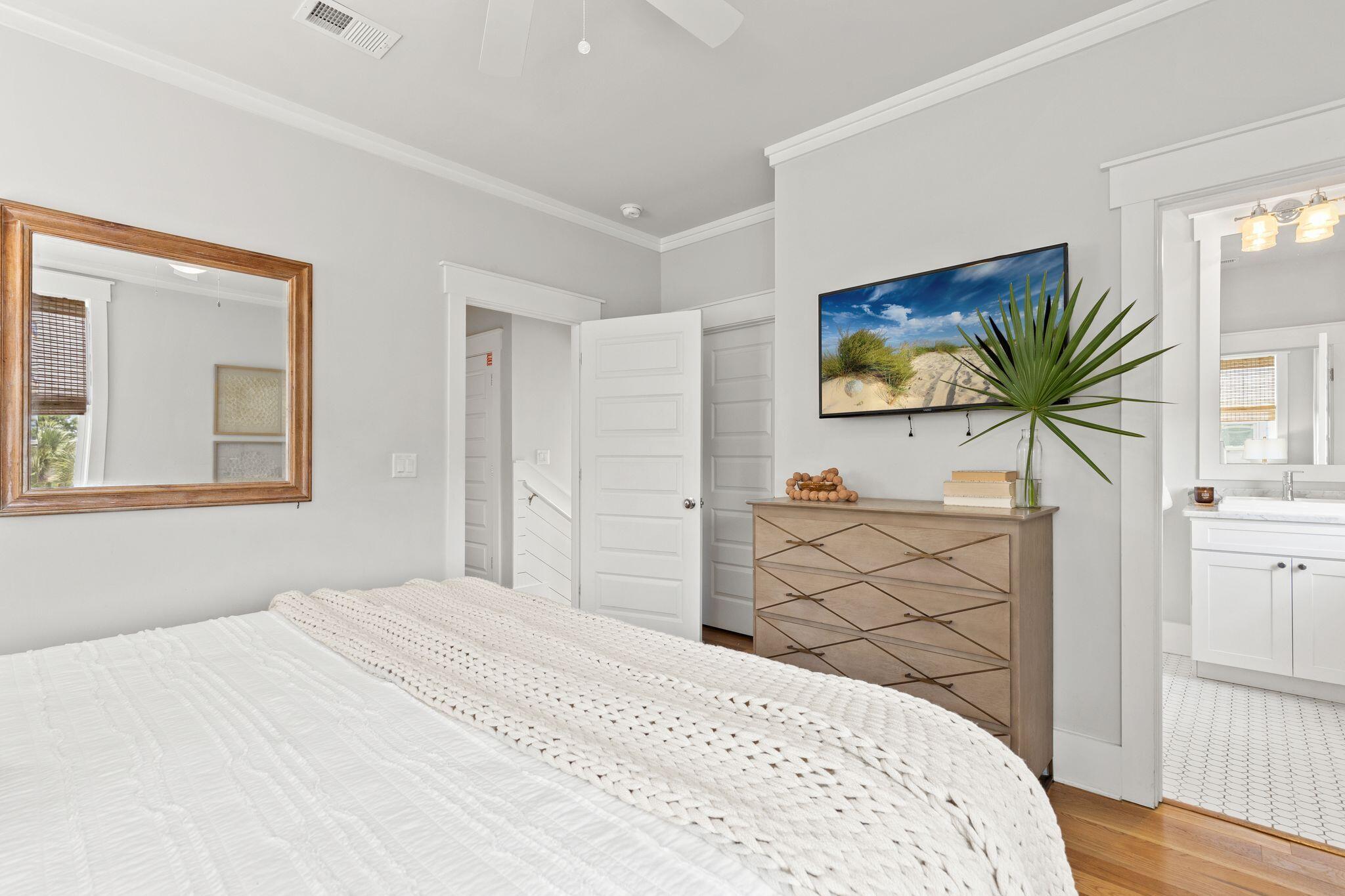 51 Trigger Trail East Inlet Beach, FL 32461 - Photo 22 of 57 a bedroom with a bed and a flat screen tv