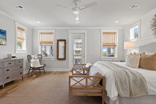 a view of a sink a mirror and with potted plant in a bathroom