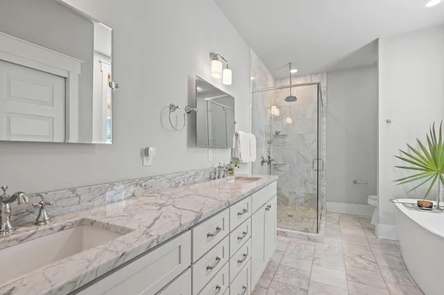 a view of a porch with wooden floor and outdoor seating