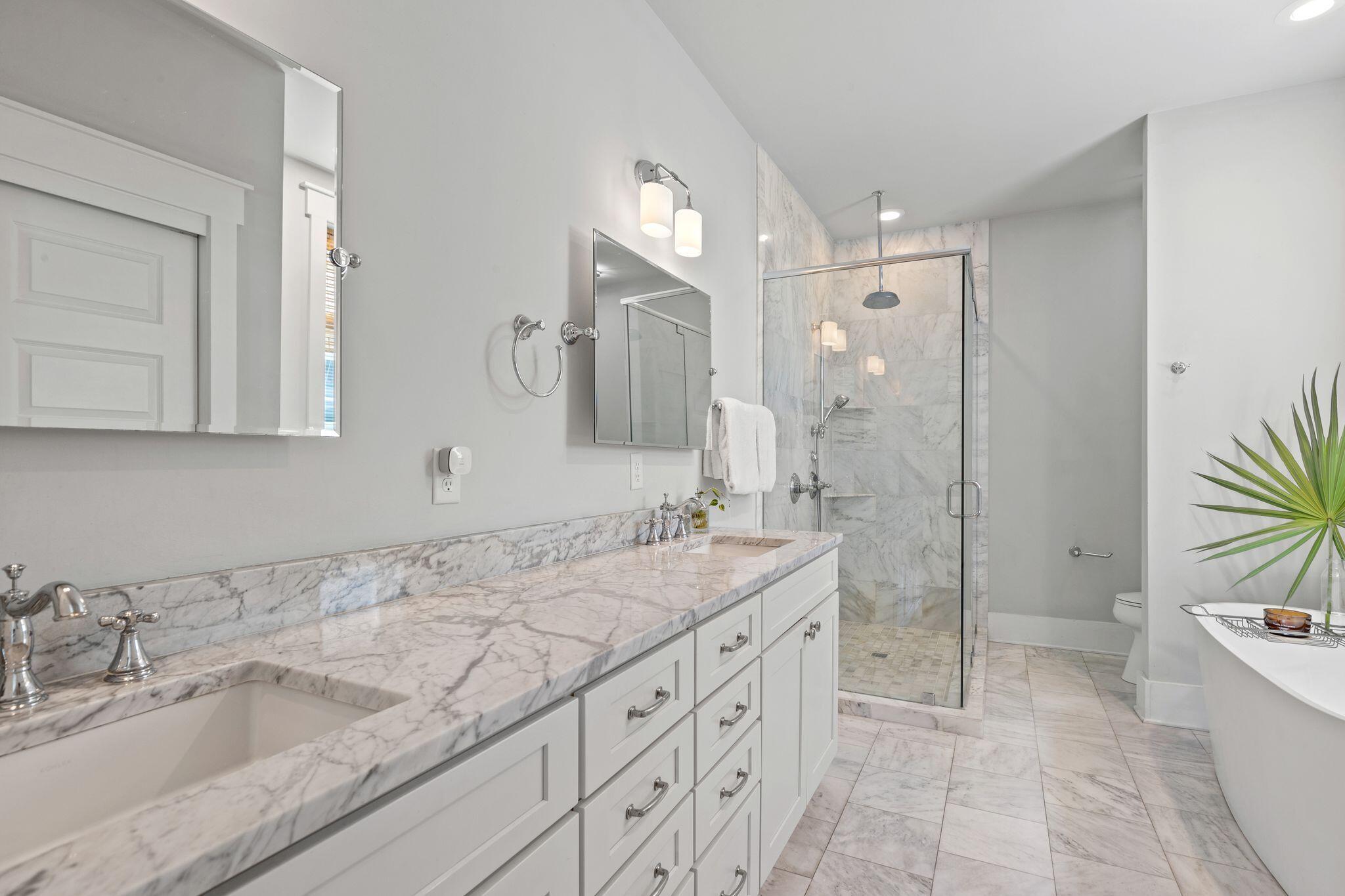 51 Trigger Trail East Inlet Beach, FL 32461 - Photo 31 of 57 a bathroom with a granite countertop sink mirror and a bathtub