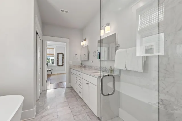 a view of a porch with wooden floor and outdoor seating