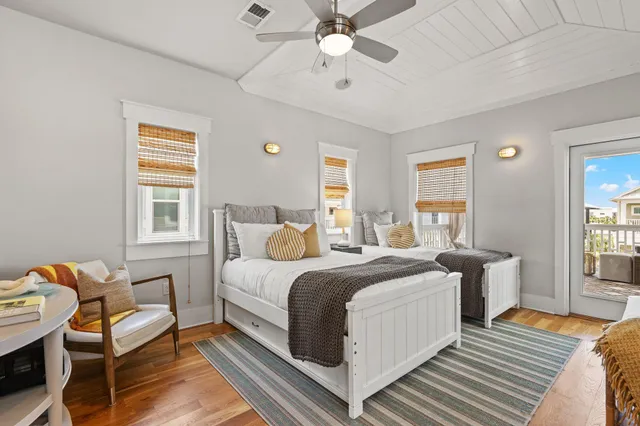 a balcony with furniture and wooden floor