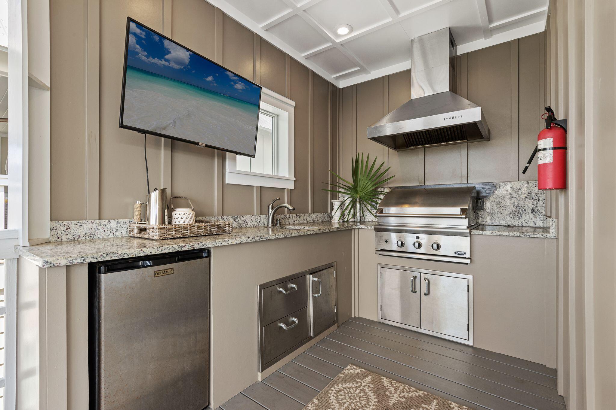 51 Trigger Trail East Inlet Beach, FL 32461 - Photo 47 of 57 a kitchen with stainless steel appliances granite countertop a sink stove and cabinets