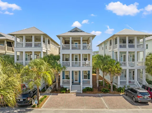 an aerial view of residential building and an ocean