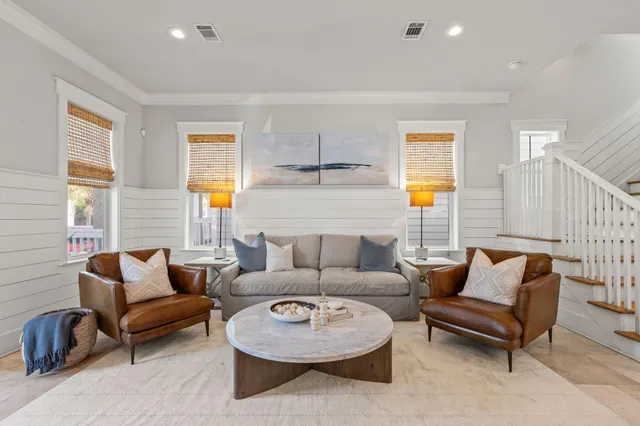 a living room with fireplace furniture and a flat screen tv