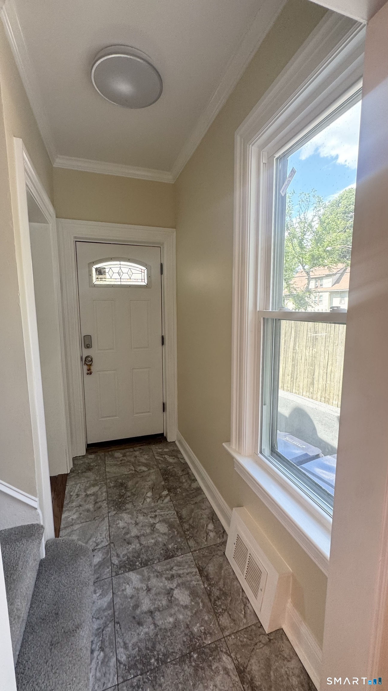 104 Prospect Street Ansonia, CT 06401 - Photo 18 of 40 a view of an empty room and a window