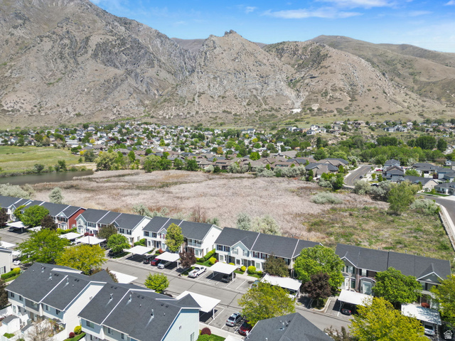 732 North 200 E Street Springville, UT 84663 - Photo 34 of 36 Aerial perspective showcasing a community of townhomes and single-family residences set against a mountain backdrop