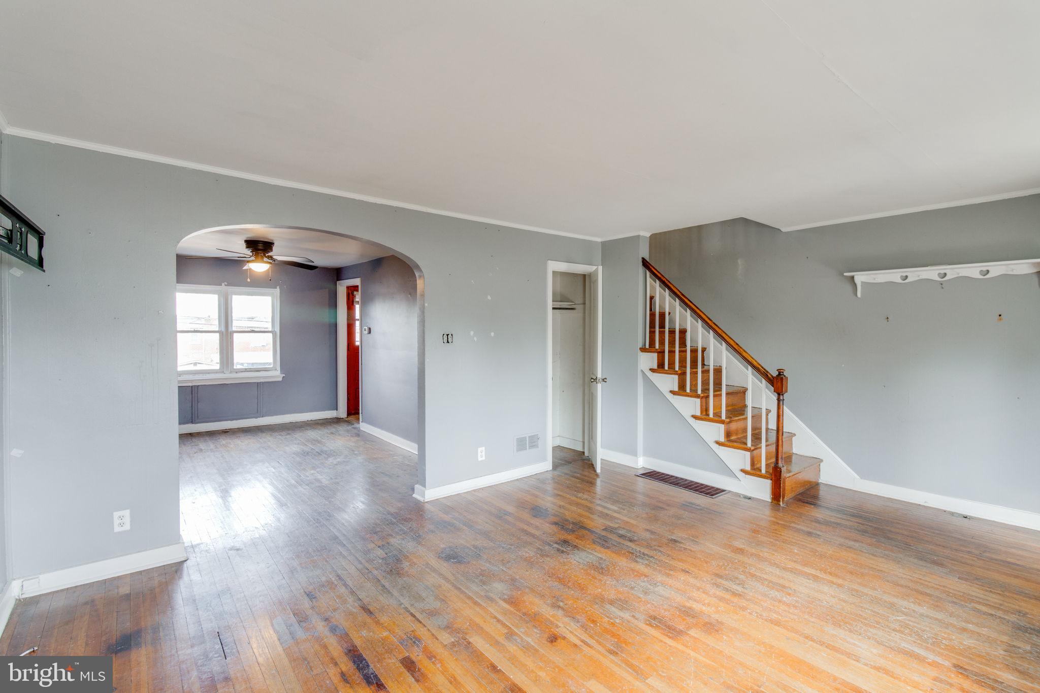 1015 Clark Street Lancaster, PA 17602 - Photo 3 of 14 a view of an empty room with wooden floor and a window