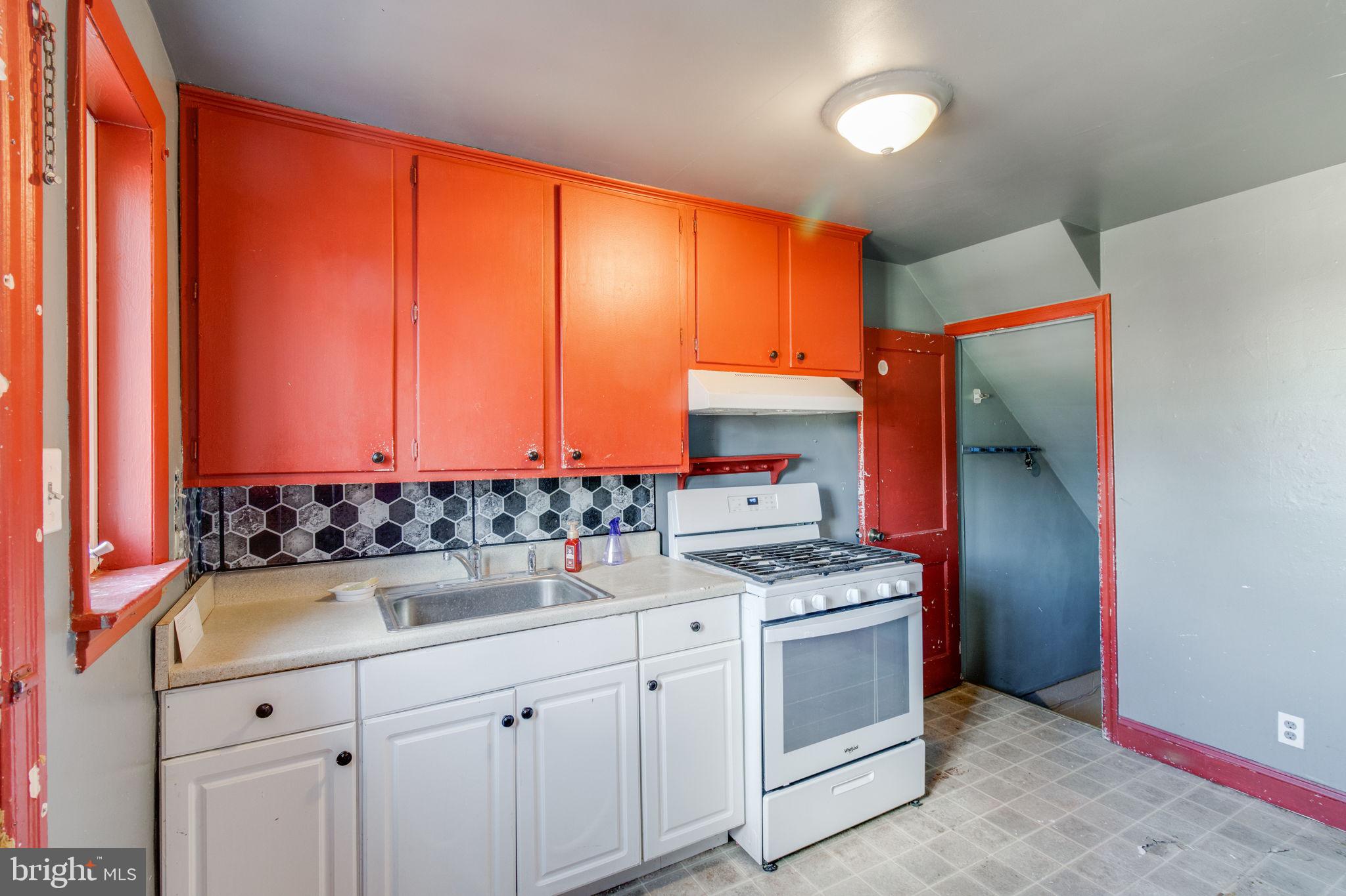 1015 Clark Street Lancaster, PA 17602 - Photo 6 of 14 a kitchen with stainless steel appliances a sink stove and cabinets