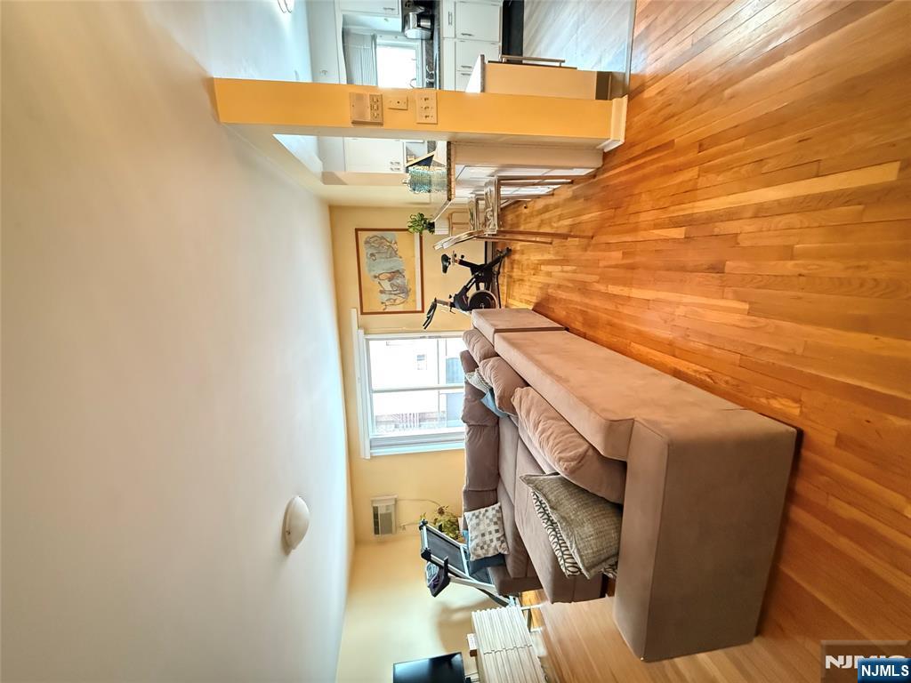 101 Orient Way, Unit 2C1 Rutherford, NJ 07070 - Photo 3 of 12 a living room with furniture and a wooden floor