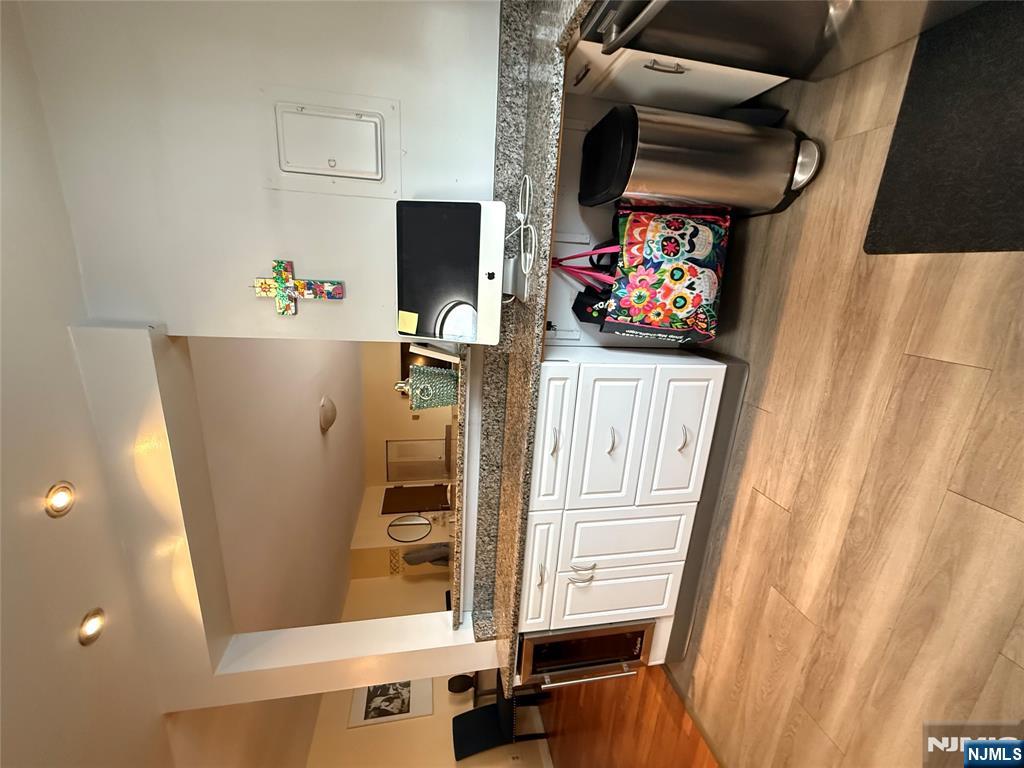 101 Orient Way, Unit 2C1 Rutherford, NJ 07070 - Photo 5 of 12 a living room with furniture and flat screen tv