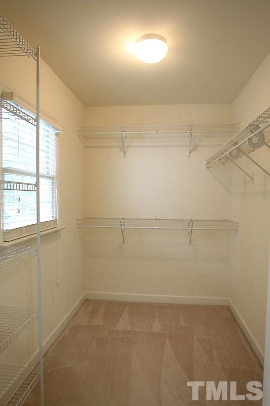 5425 Goldenglow Way Raleigh, NC 27606 - Photo 12 of 17 a view of a room with racks on the wall