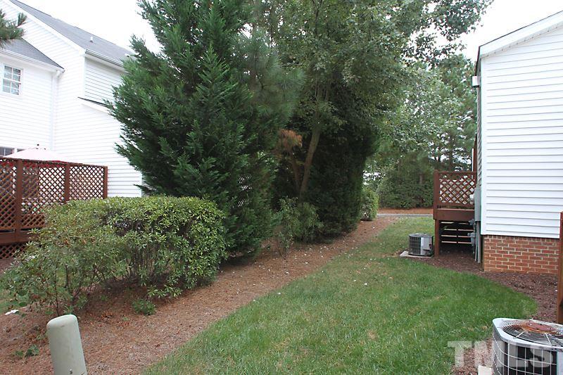 5425 Goldenglow Way Raleigh, NC 27606 - Photo 16 of 17 a view of a bench in the garden