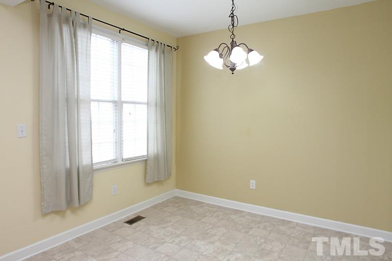 5425 Goldenglow Way Raleigh, NC 27606 - Photo 6 of 17 a view of an empty room with a window