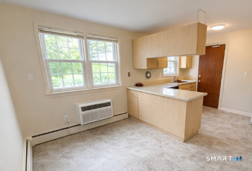 949 Hopmeadow Street, Unit 28 Simsbury, CT 06070 - Photo 2 of 10 a view of kitchen and sink